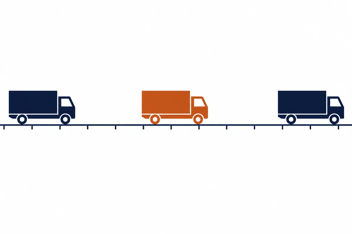 Three trucks standing far apart along one long road line